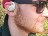 Person wearing the Oladance open ear headphones.